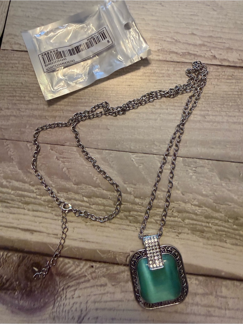 Silver-Tone Necklace with Green Square Glass Pendant and Crystal Accents